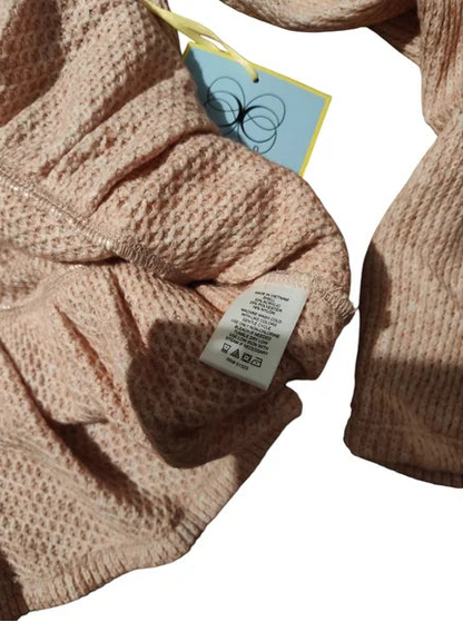 Cece Beige Pink knitted sweater with a tag on a white background