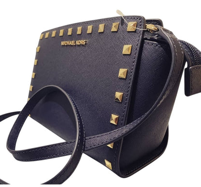 Michael MK kors Women's Navy Blue Selma messenger bag with gold studs accent.
