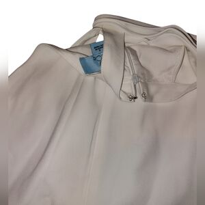 CECE White Halter dress with a blue cece tag on a white background